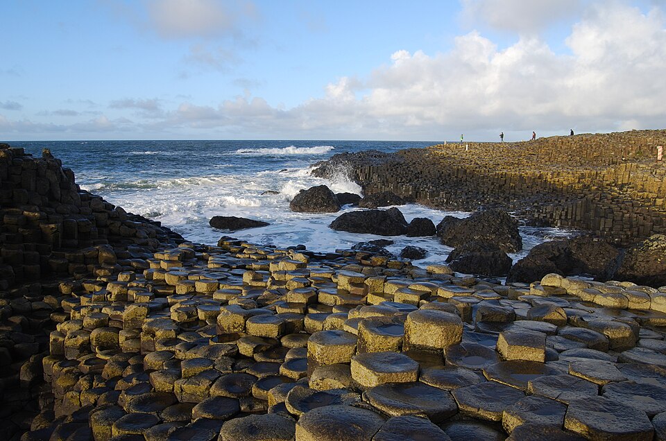 Hexagonal stone columns at the Giant’s Causeway meeting the sea